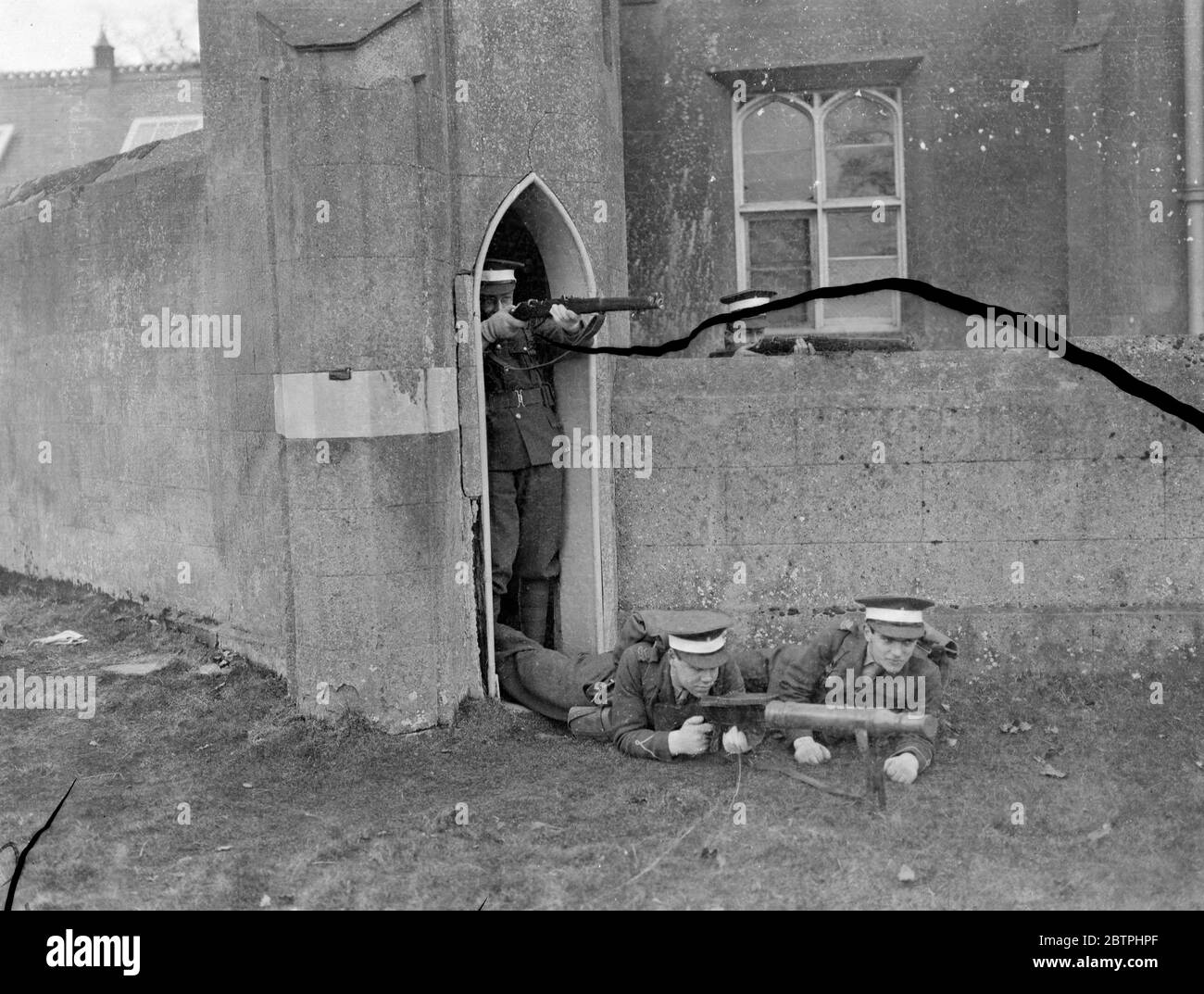 Eton College Field Day . Defending a castle ( the keeper 's lodge ) in Windsor Park during the Eton College Officers Training Corps Field Day . 17 March 1932 Stock Photo