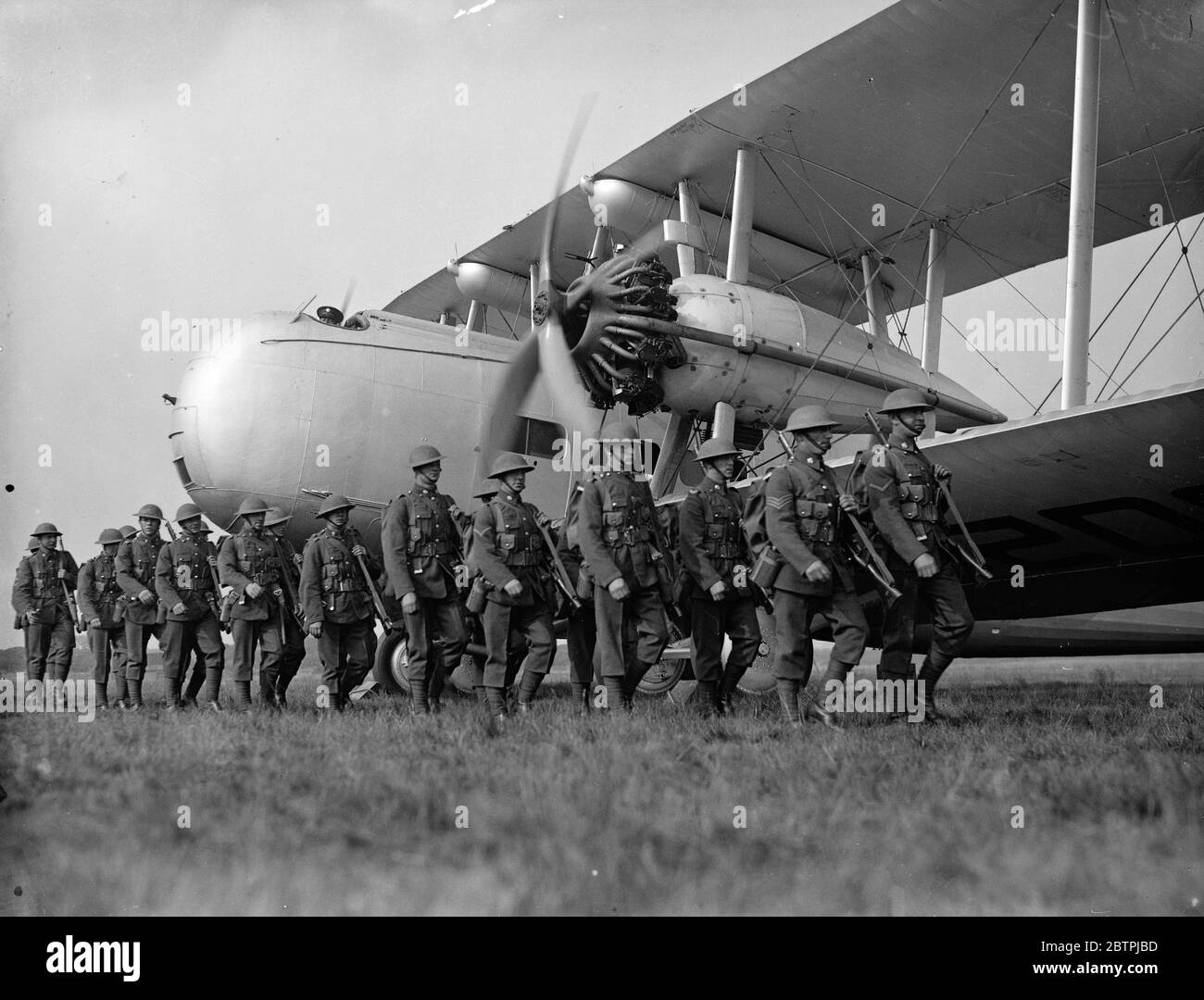 Making soldiers air minded . Steel helmeted troops taken for flights at Farnborough . Troops boarding the new Vickers Valancia troop carrying machine at Farnborough . 25 July 1935 Stock Photo