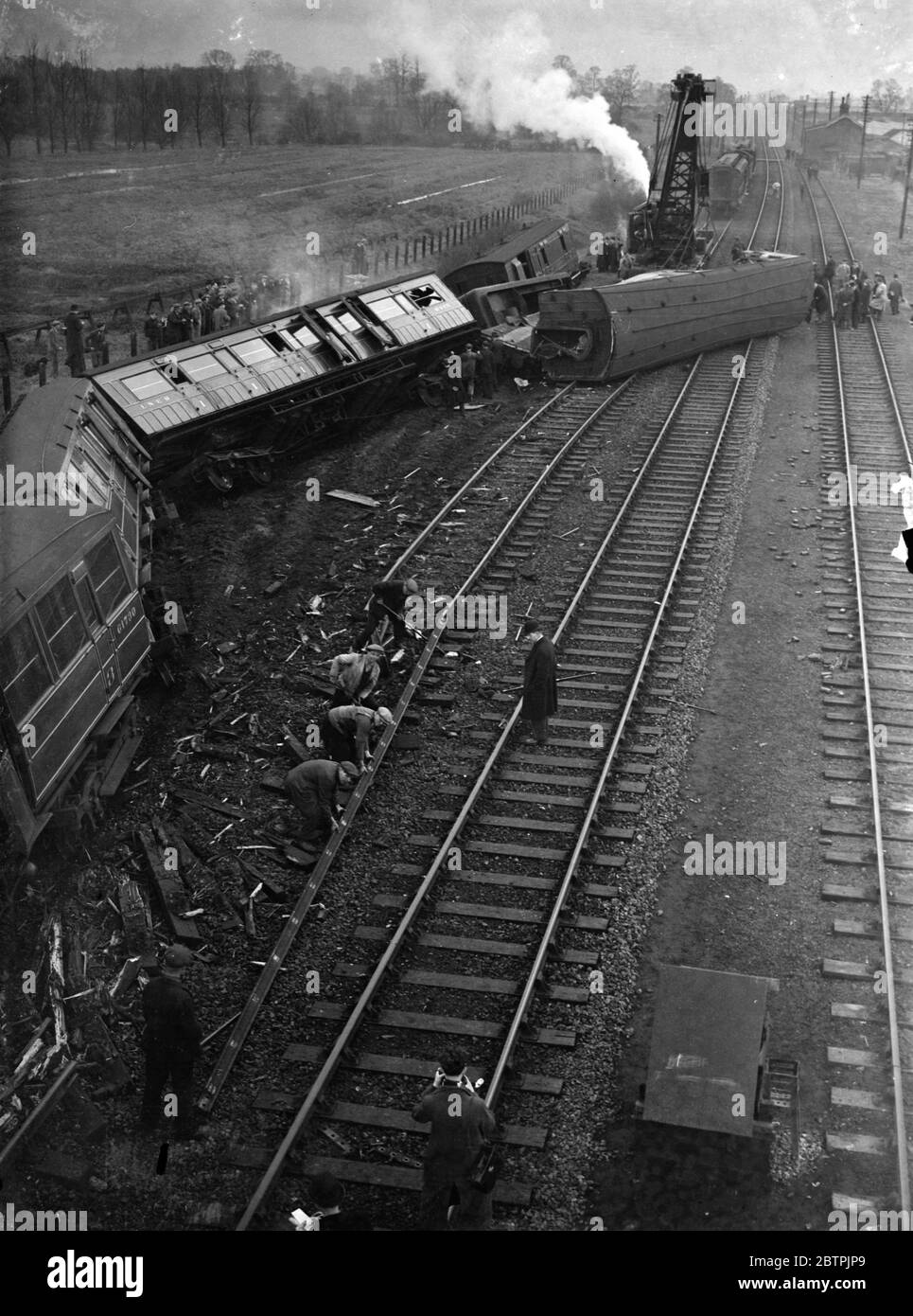 Train Crash . A view of the rail disaster . 2 killed and many injured in London express train smash with a lorry on a level crossing at Wharf Road . Clearing the wreckage . 27 November 1934 Stock Photo