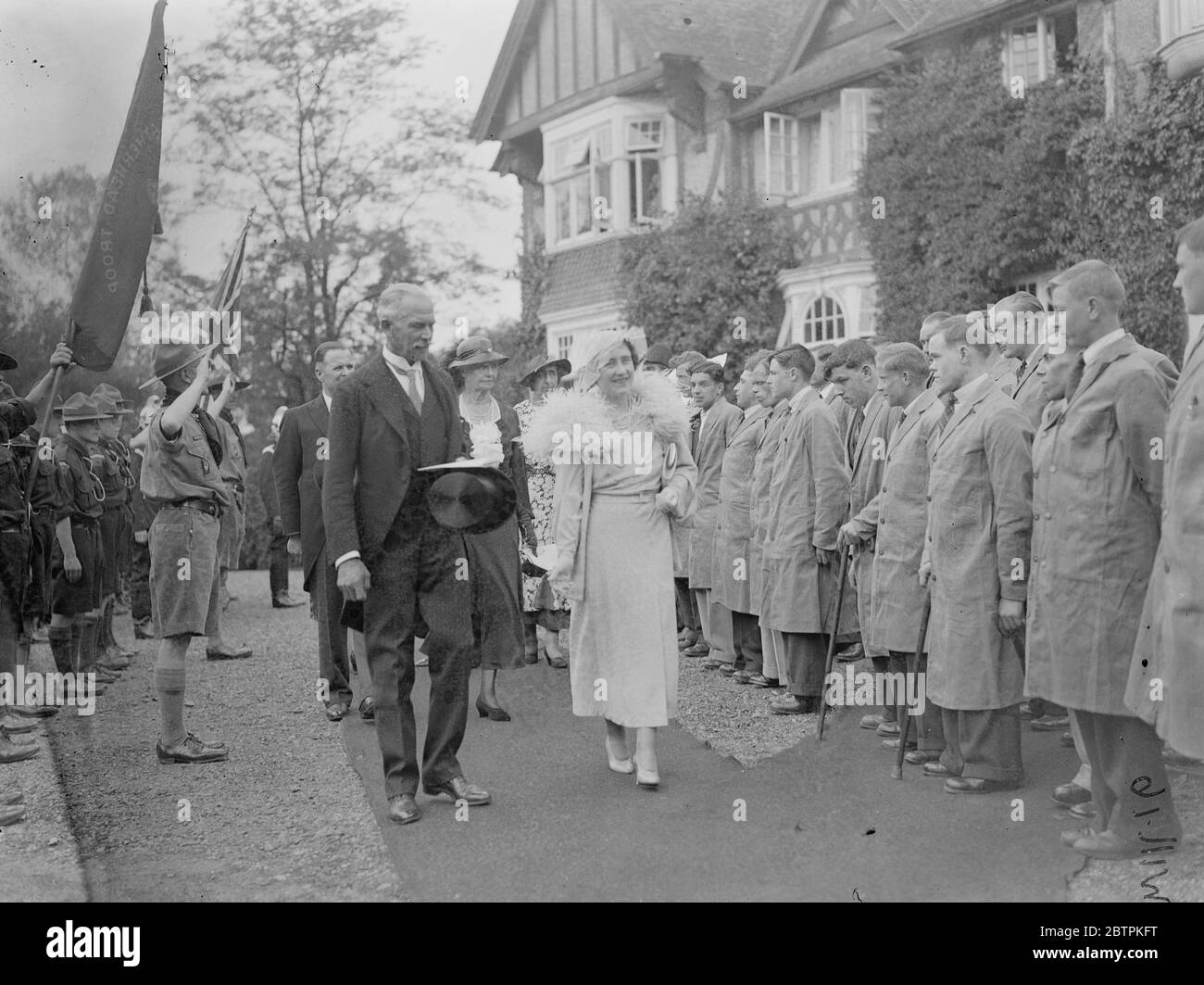 The Duchess of York . Opens new cripples training college at Leatherhead . The Duchess of York inspecting some of the boys of the College on arrival . 27 June 1935 Stock Photo