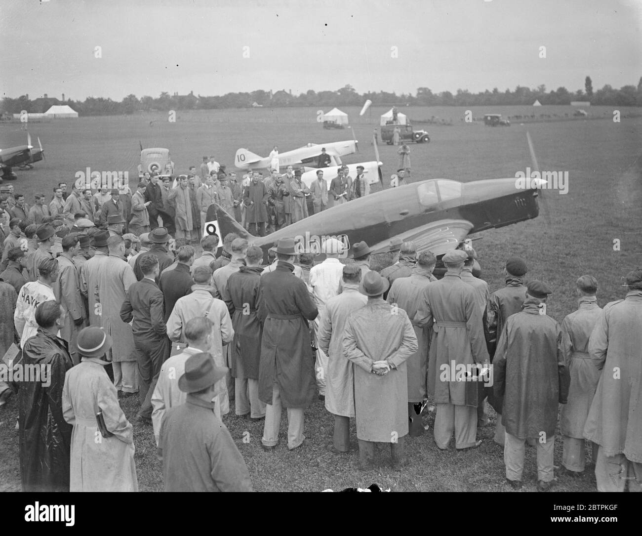 Lord Wakefield ' s plane starts in King ' s Cup air race . The King ' s Cup air race started from Hatfield Aerodrome . There are 28 entries . The first of the two days of the contest takes the form of elimination in a race over two circuits of a course of 612 miles , making 1 , 224 miles in all . Fifty per cent of the starters in each of the three groups of aircraft will pass into the final . Final shows, Lord Wakefield ' s T K2 piloted by R J Waight starting . 10 July 1936 Stock Photo