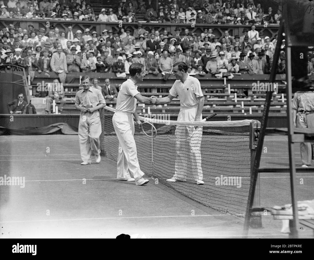 Wimbledon tennis championships open . Perry meets Stratford . G D Stratford in play against Fred Perry . 22 June 1936 Stock Photo