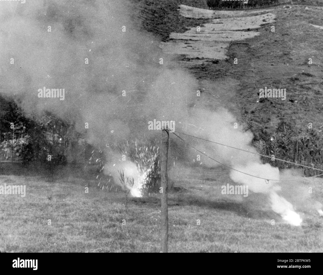 Bombing of Dessye . Incendiary bombs bursting and burning harmlessly as they fall on open ground just outside Dessye . 16 December 1935 Stock Photo