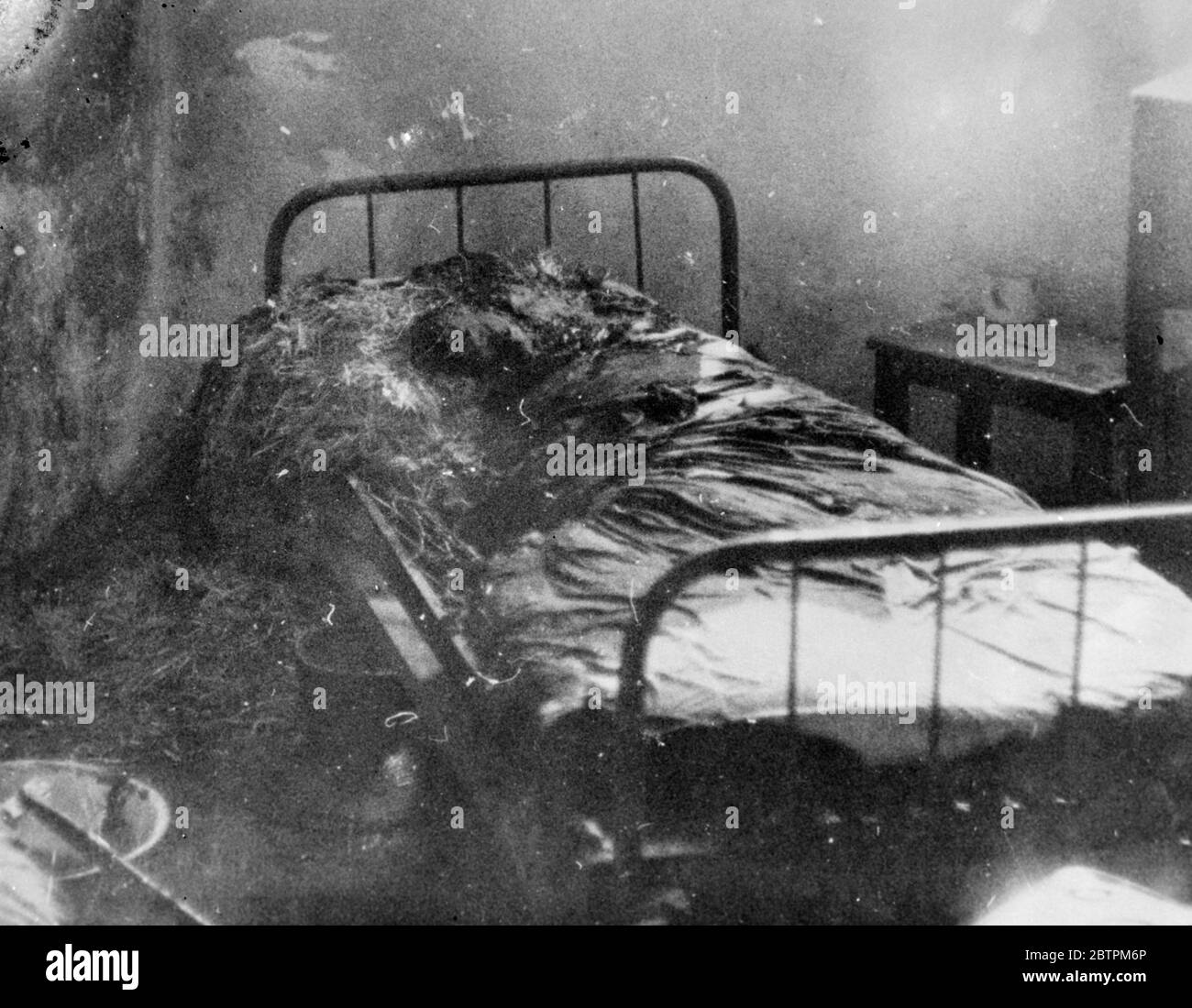 Bombing of Dessye . A burning hospital bed in the American Hospital after it had been struck by a direct hit from an Italian bomb during the air raid . 16 December 1935 Stock Photo