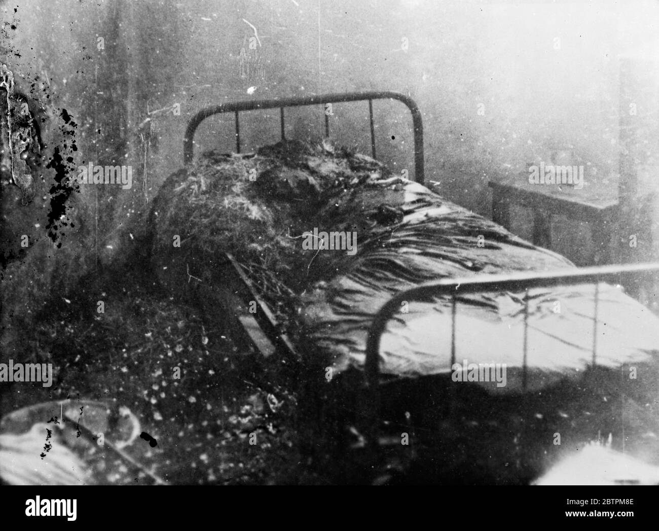 Bombing of Dessye . A burning hospital bed in the American Hospital after it had been struck by a direct hit from an Italian bomb during the air raid . 16 December 1935 Stock Photo