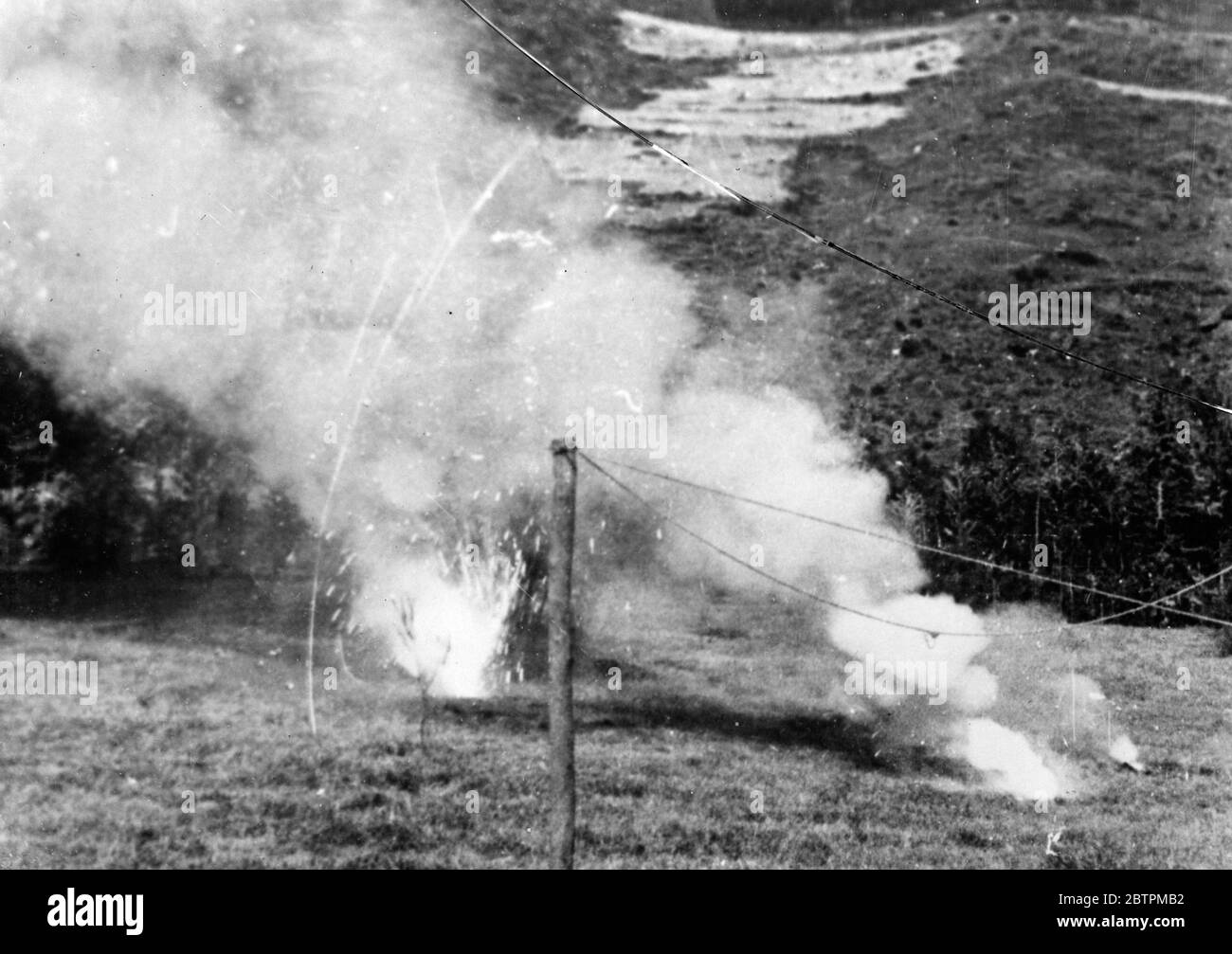 Bombing of Dessye . Incendiary bombs bursting and burning harmlessly as they fall on open ground just outside Dessye . 16 December 1935 Stock Photo