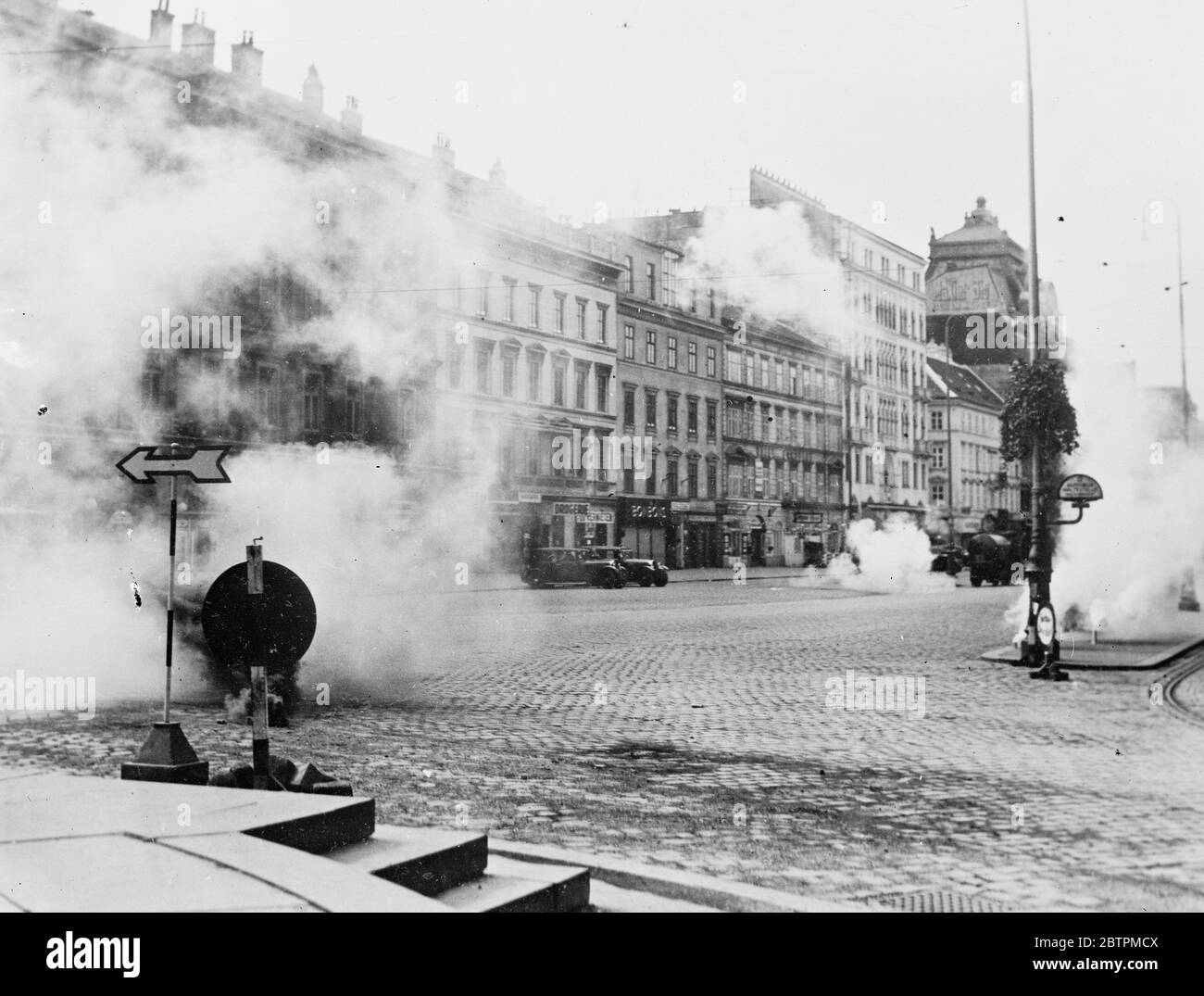 Air raid on Vienna . The anti air raid exercise organised in Vienna by the Austrian Government were the most realistic in the memory of Viennese . ' Poison gas ' rose in clouds , ' bombs ' exploded and firemen and first aid workers toiled amid the wreckage of buildings and vehicles . Photo shows , ' Poison gas ' near the Prater in Vienna . 16 September 1935 Stock Photo