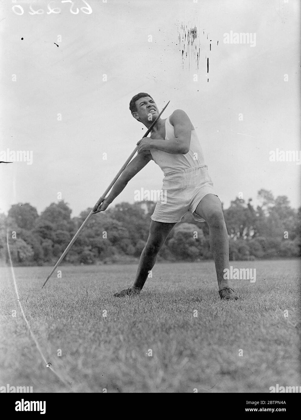 Power!. ORIGINAL Caption: Like a piece of Greek statuary, C Holloway, a coloured athlete of Brixton building school, symbolises human power against the belching towers of Battersea Power Station as he practices the javelin throw in Battersea Park in readiness for the White city school sports. 6 June 1937 Stock Photo