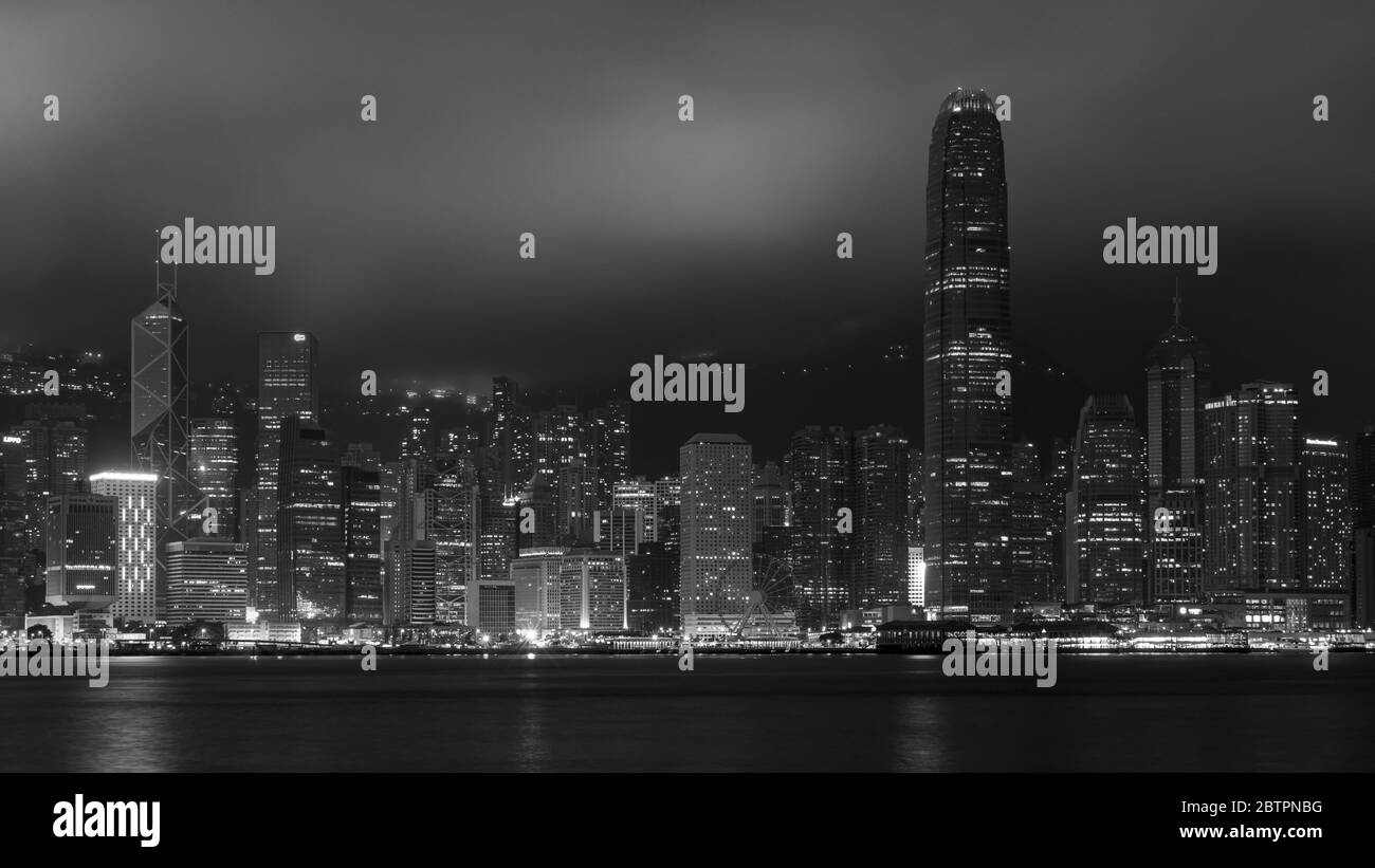 Hong Kong / China - July 26, 2015: Panoramic night view of Hong Kong skyline across Victoria Bay Stock Photo