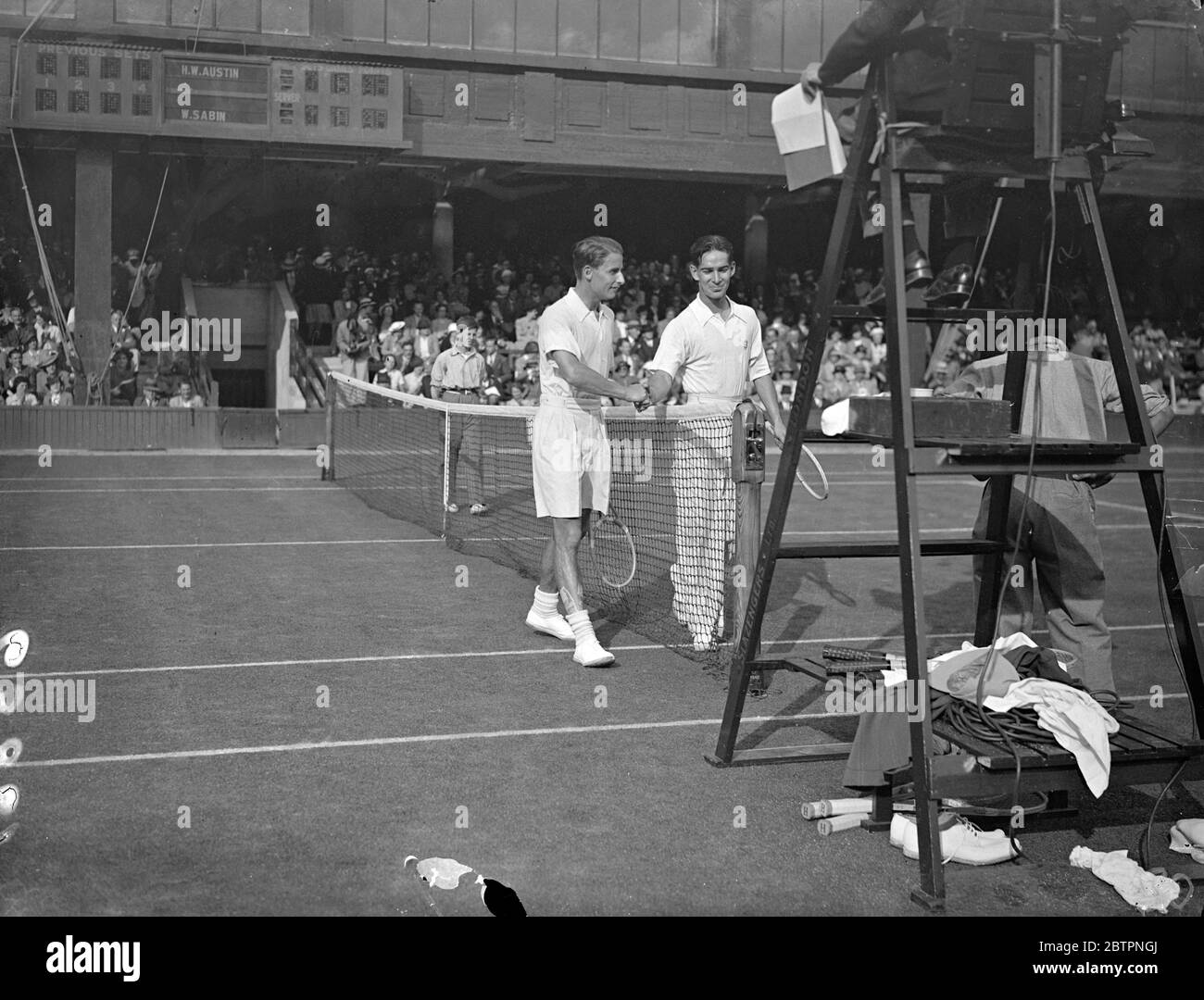 Austin defeats American at Wimbledon. H W (Bunny) Austin of Great Britain beat the American, W Sazin, 6-2,6-3,6-0 in the men's singles at Wimbledon. Photo shows, H W Austin being congratulated by W Sazin after their match. 23 June 1937 Stock Photo