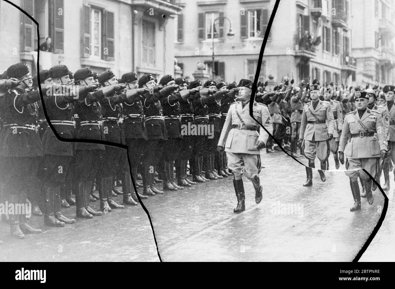 Mussolini inspects his musketeers. Signor Mussolini inspected his own Musketeers in Rome when they celebrated the 15th anniversary of the foundation. 14 February 1938 Stock Photo