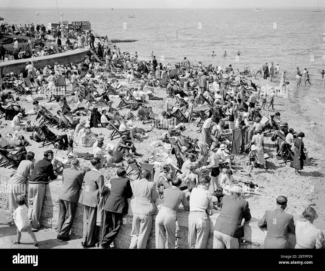 Crowds Pack Ryde, Sunny holiday. Favoured by the sun, large crowds thronged Ryde, Isle of Wight, today (Bank Holiday Sunday). Photo shows, the crowd on the sunny beach at Ryde. 31 July 1938 Stock Photo