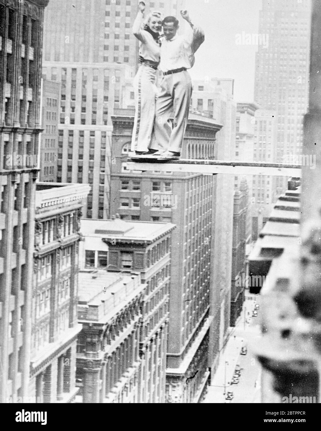False statement a 'forced landing'!. Two dancers who had to be very careful of the step were Betty and Ben Fox, who occasioned much neck craning on the loop, Chicago, when they performed the 'Big Apple' on a plank extended from the 19th floor of the La Salle Hotel. 27 April 1938 Stock Photo