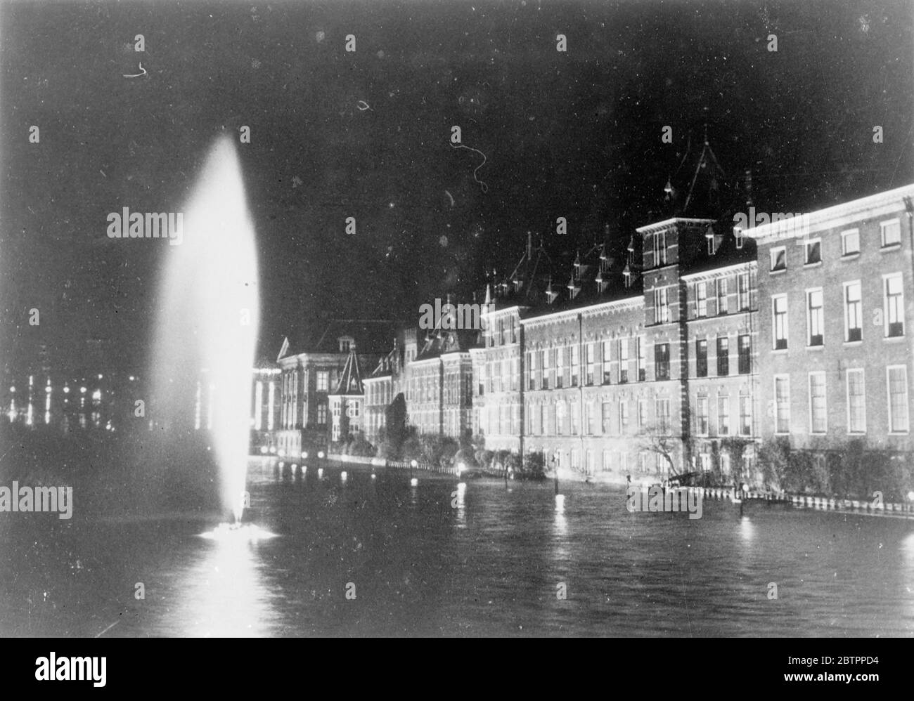Floodlights welcome Holland's new Princess. Holland's new Princess, born to Princess Juliana has been welcomed with a blaze of light. All the important buildings in the country's chief cities of flood lighted. Photo shows, floodlit government buildings at the Hague, the Dutch capital. 1 February 1938 Stock Photo