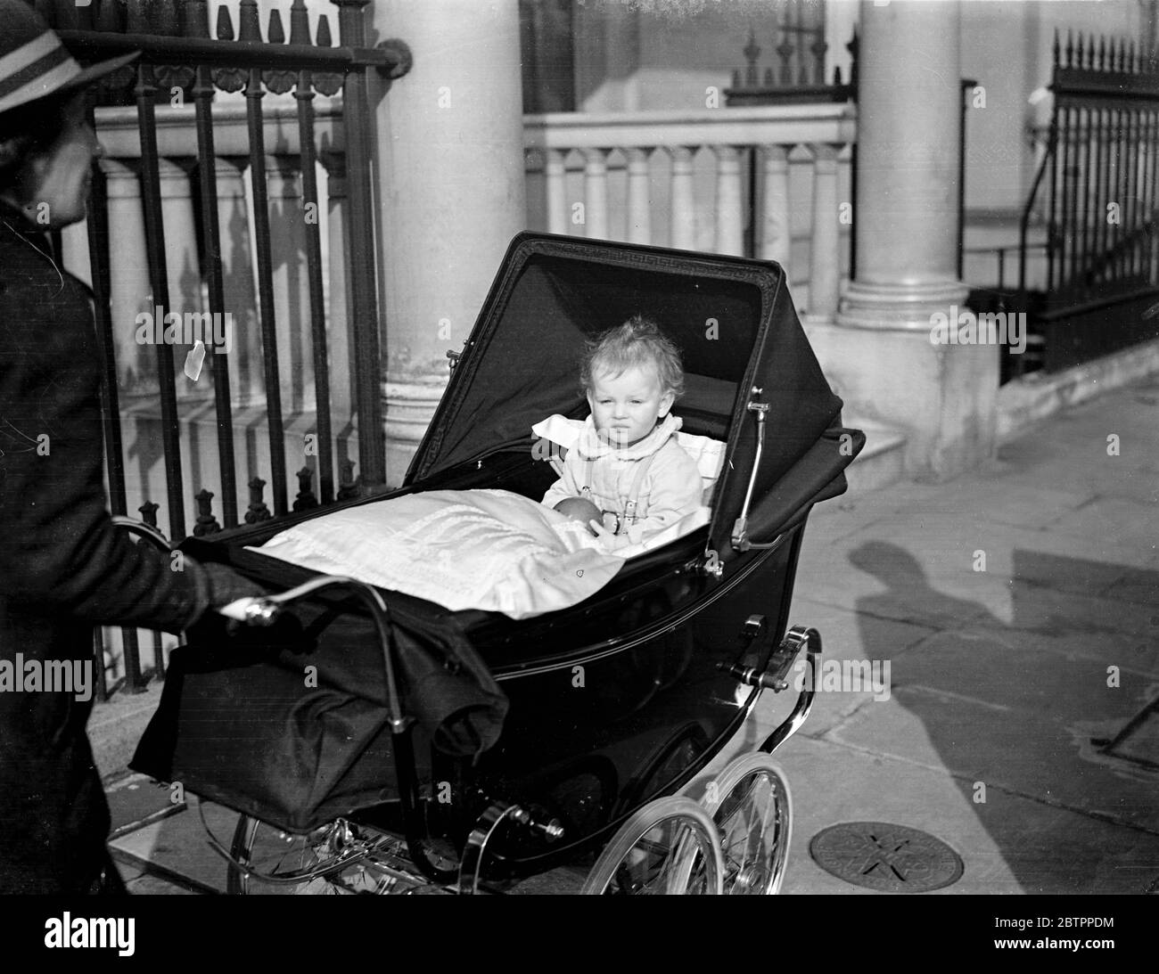 Princess Alexandra plays ball now!. Princess Alexandra, baby daughter of the Duke and Duchess of Kent clutching her ball as she returned to 3 Belgrave Square, after an outing in the sunshine. The Duke and Duchess are still in Athens owing to the death of the Duchess's father. 11 February1938 Stock Photo
