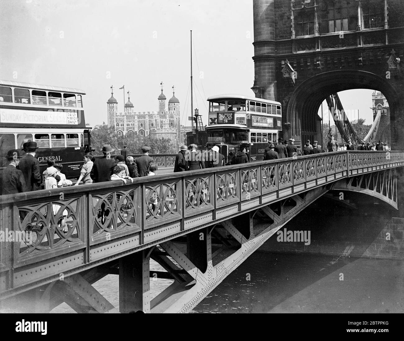 Double-decker buses crossing Tower Bridge. 1933 Stock Photo