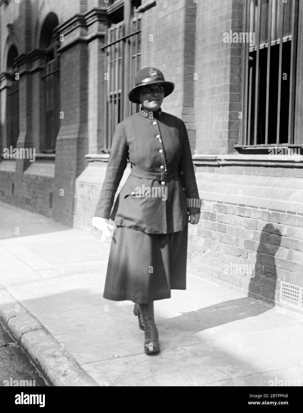 Policewoman patrolling (old dress) 1931 Stock Photo