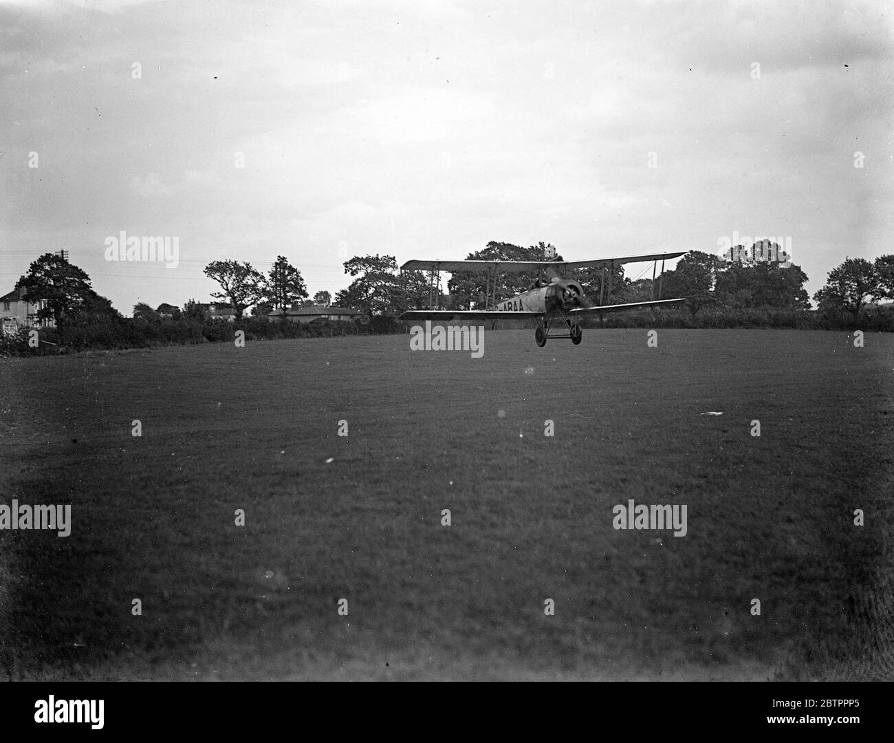 Avro Aeroplane landing (biplane) 1933 Stock Photo