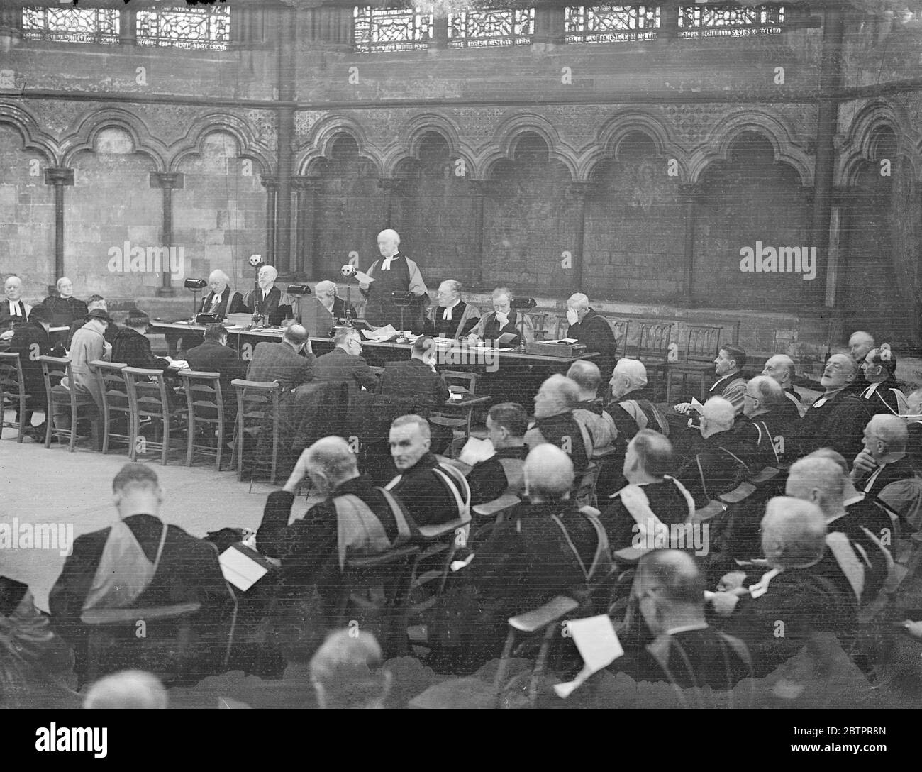 Westminster. The Dean of Norwich, as Prolocutor, opened the January group sessions of the lower house of Convocation of Canterbury in the Chapter House of Westminster. A spirited debate was anticipated when the interim report of the joint committee on the Church and State Report was sent down from the Upper House. Photo shows, The Lower House in session at the Chapter House, Westminster. 19 January 1938 Stock Photo