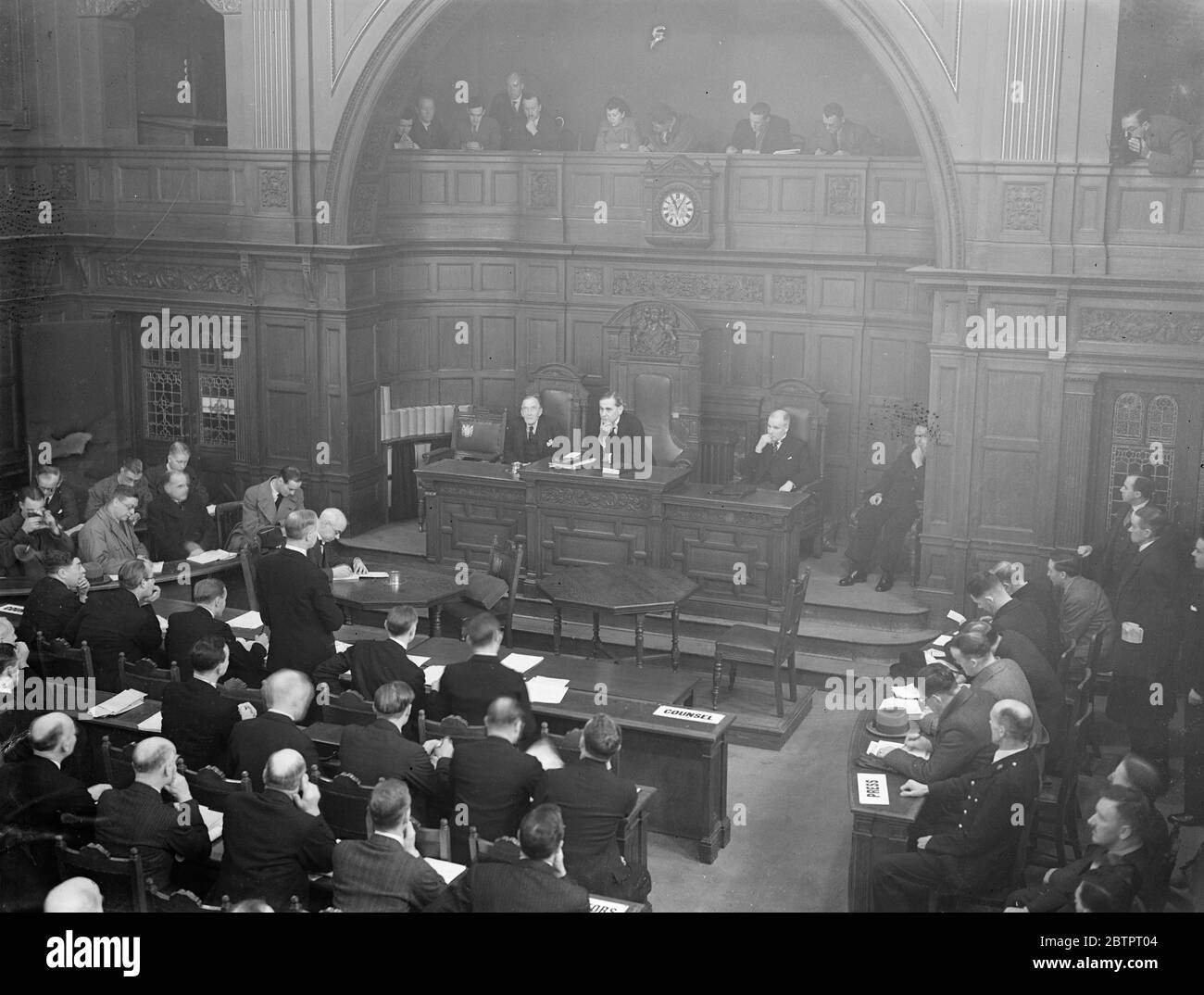 Croydon typhoid enquiry opens. Inquiry into the Croydon typhoid epidemic has opened a Croydon Town Hall. Sir Walter Monckton, KC, is appearing for the Croydon Borough Council and Mr PM Sandiands, KC for the Croydon medical officer. Photo shows, a general view of the inquiry with MrH L Murphy and, KC and the two assessors presiding. 6 December 1937 Stock Photo