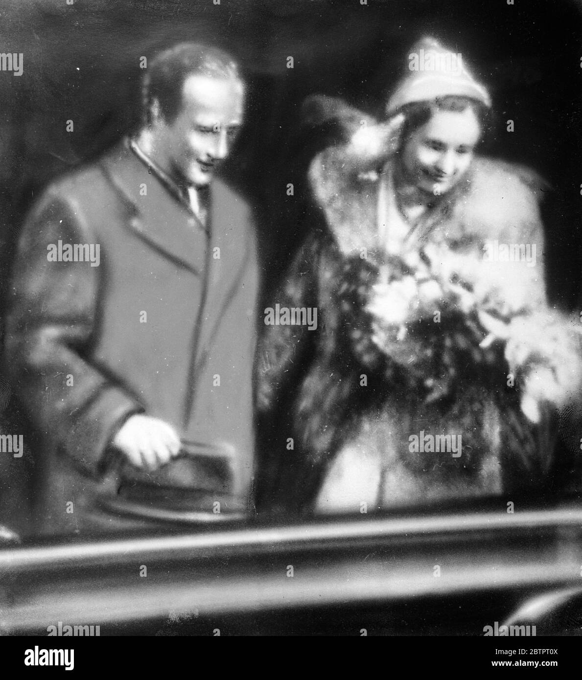 Telephoto. Prince Starhemberg weds actress in Vienna. Prince Starhemberg , the former vice chancellor of Austria, was married to Fraulein Nora Gregor, leading lady at the Vienna State theatre, in Vienna. The ceremony was conducted by Cardinal Innitzer, Archbishop of Vienna, in the private chapel of the Bishops Palace. Photo shows, Prince Starhemberg and his bride, leaving the Chapel after the wedding. 2 December 1937 Stock Photo