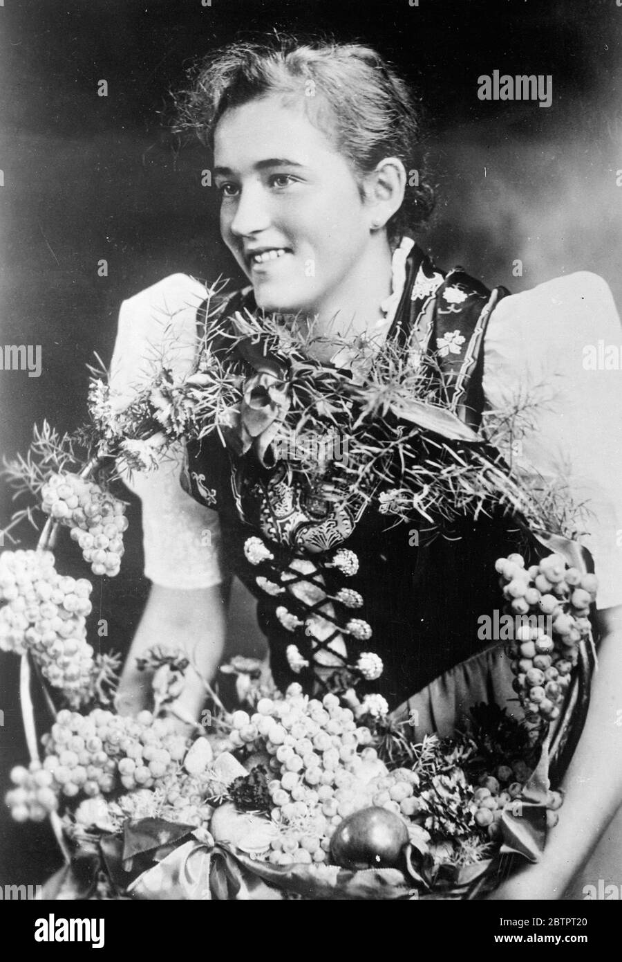 Germany's Wine Queen. Fraulein Gustel Hauptmann, who has been chosen German Wine Queen at the wine harvest festival at Neustadt in the Palatine. Fraulein Hauptmannn comes from the wine village of Haardt near Neustadt. 26 October 1937 Stock Photo
