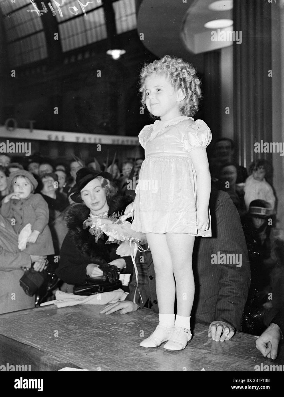 Small speech maker. Binkie Stuart, film actress presents prizes at North London exhibition. Three year-old Binkie Stuart, the film actress, presented prizes in the competition organised for housewives in connection with the north London exhibition at the Alexandra Palace. Photo shows Binkie Stuart making a speech at the prize-giving. 29 October 1937 Stock Photo