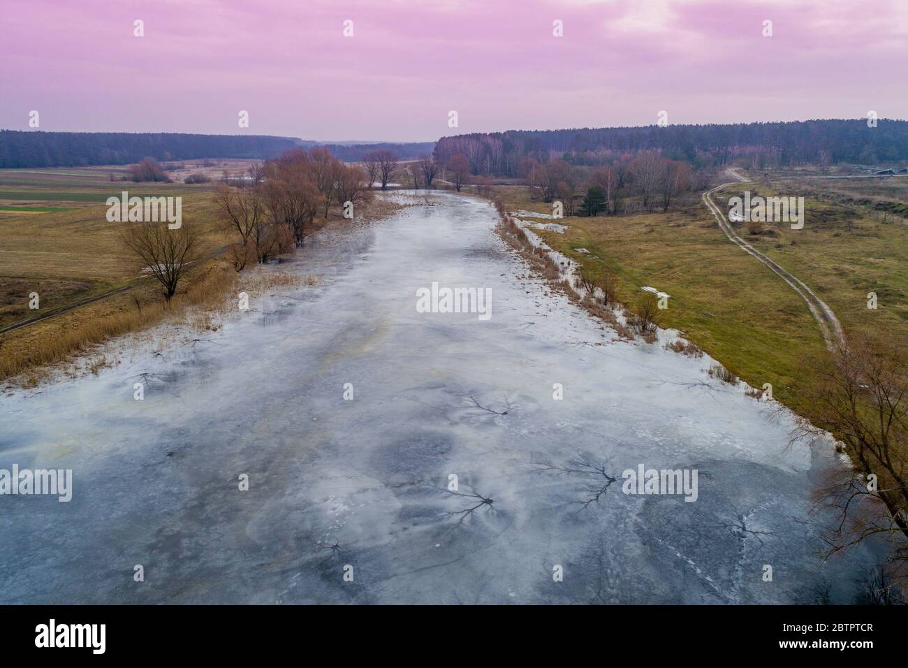 Rural landscape. Aerial view of the frozen river in winter Stock Photo ...