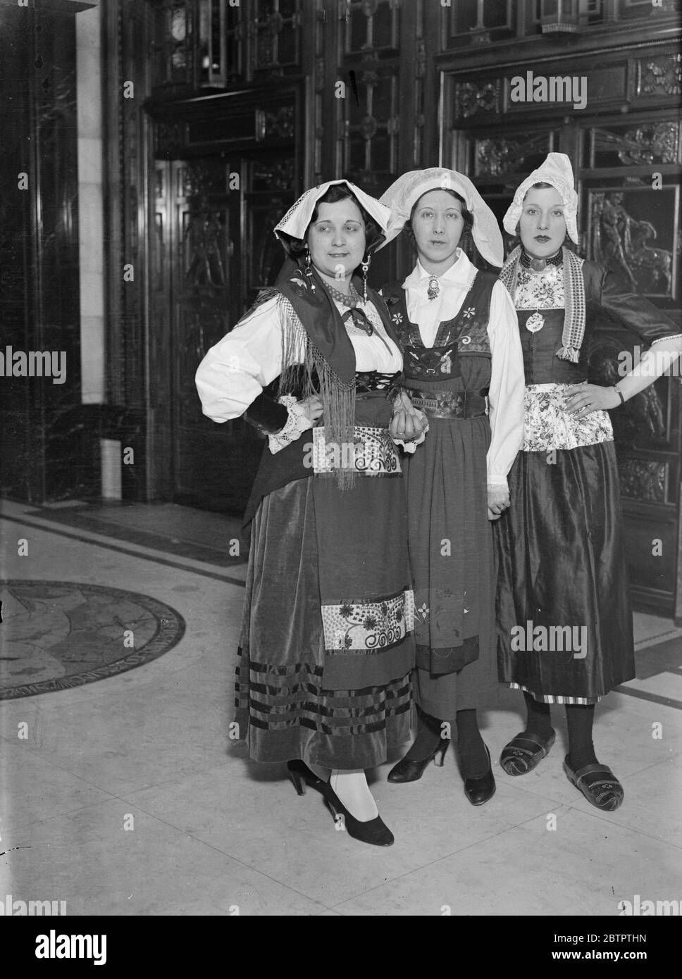 International beauties in London . Beaties of Holland , Sweden and Italy , typical national types , have been brought to London by Selfridges with the idea of popularising British perfumry among visitors from these countries now in London . They are a great attraction in the store . The trio of national beauties from ( left to right ) Italy , Sweden and Holland , in their national costumes in the London store . 26 February 1932 30s, 30's, 1930s, 1930's, thirties, nineteen thirties Stock Photo