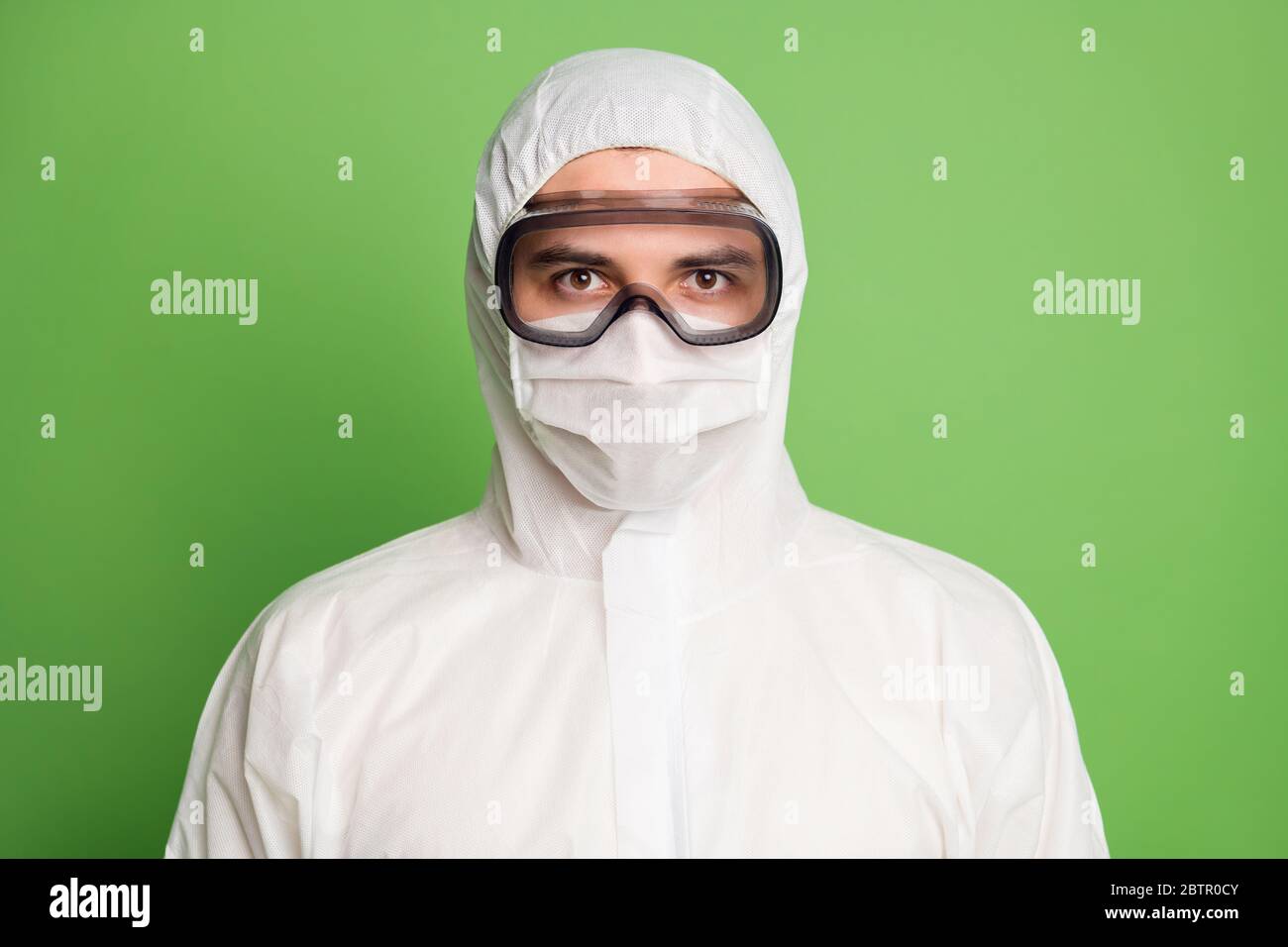 Close-up portrait of his he nice serious doc expert wearing white gauze mask visit patient sars ncov n-cov-2 consultant first aid 24.7 emergency Stock Photo