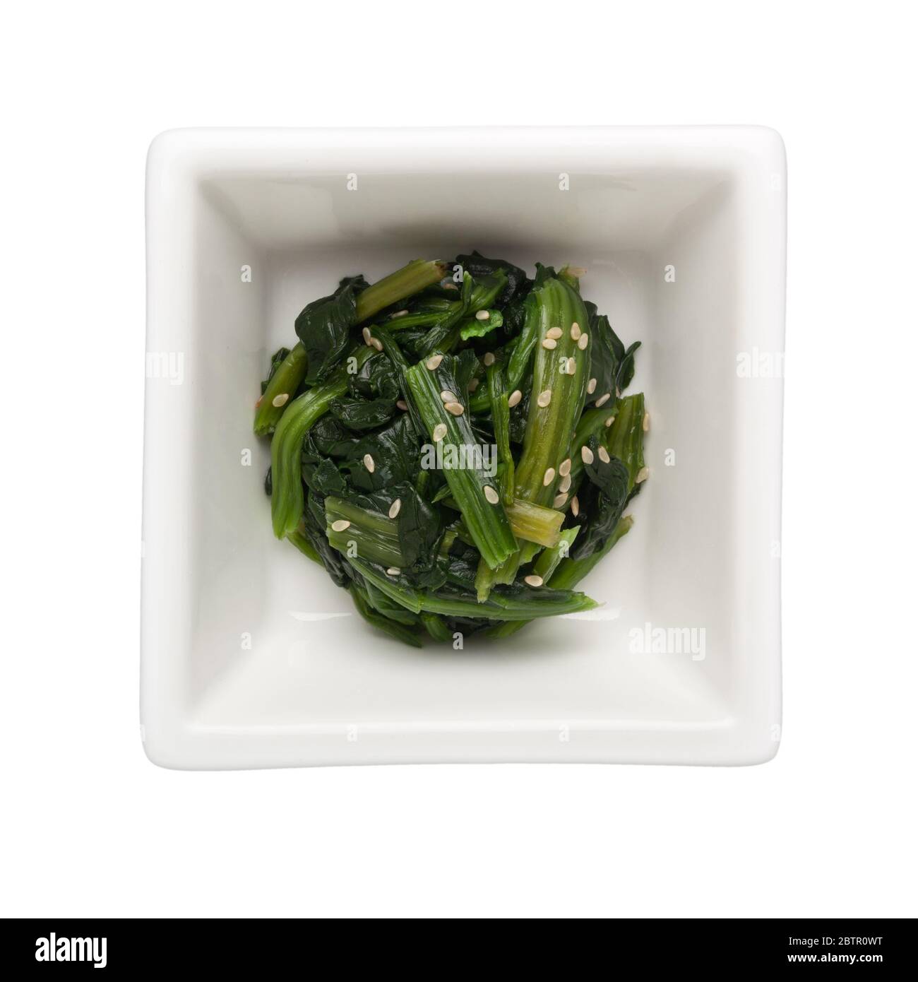 Ohitashi - Japanese vegetable salad in a square bowl isolated on white background; Stock Photo