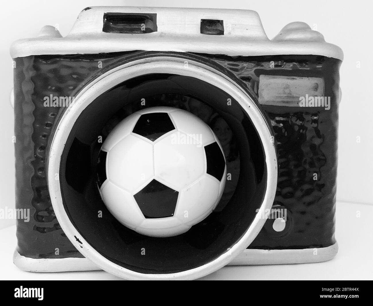 photo camera and soccer ball Stock Photo Alamy