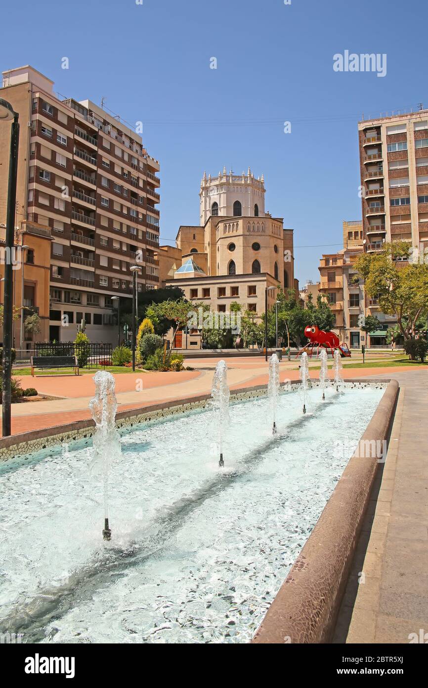 City center fountain in a park with the Cathedral in the background,  in the city of Castellón, Valencia, Spain. Stock Photo