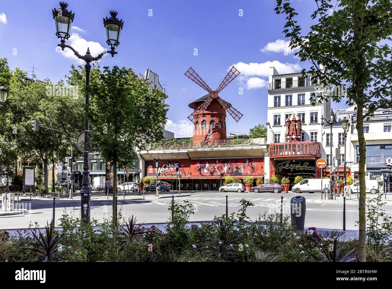 Paris, France - May 20, 2020: Moulin Rouge is a famous Parisian cabaret built in 1889, locating in Paris red-light district of Pigalle on Boulevard de Stock Photo