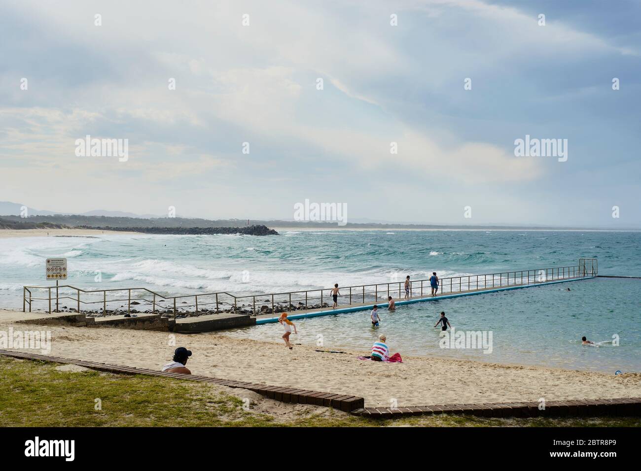 Rock pool in Port Macquarie during nice weather with families bathing Stock Photo