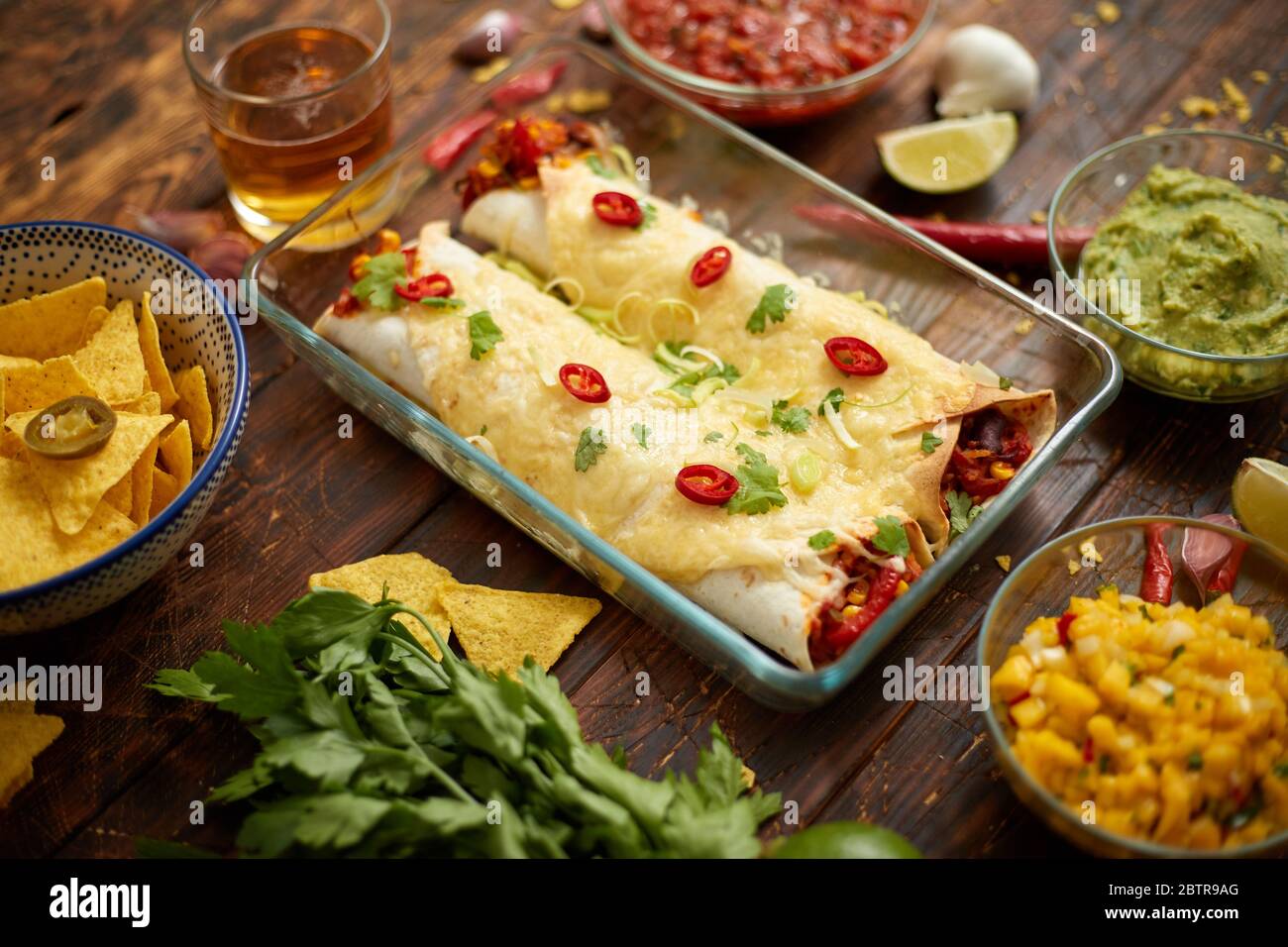 Vegetable Burritos served in glass heatproof dish. With salsa