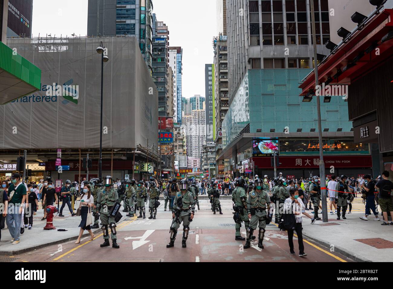 Hong Kong police control access to a street in the central Mongkok neighbourhood during the demonstrations.A new wave of protests rise in Hong Kong at the news that the Chinese government will unilaterally pass the National Security Law 23. Stock Photo