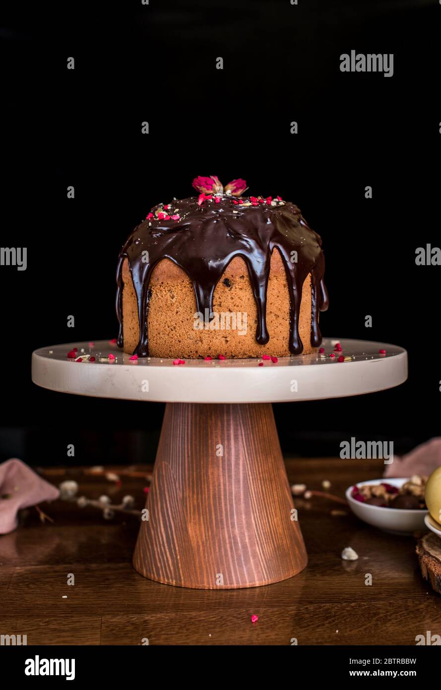 Easter composition with sweet bread, kulich and eggs on light background. Easter holidays breakfast concept. Stock Photo