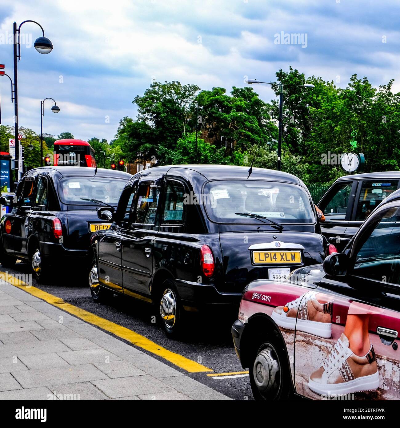 Traditional London Black Cabs Parked, Waiting For A Fare, with No People Stock Photo