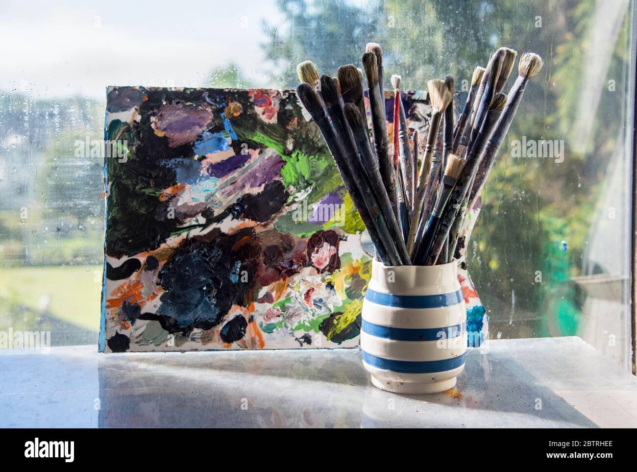 Art materials in an artists's studio. Stock Photo