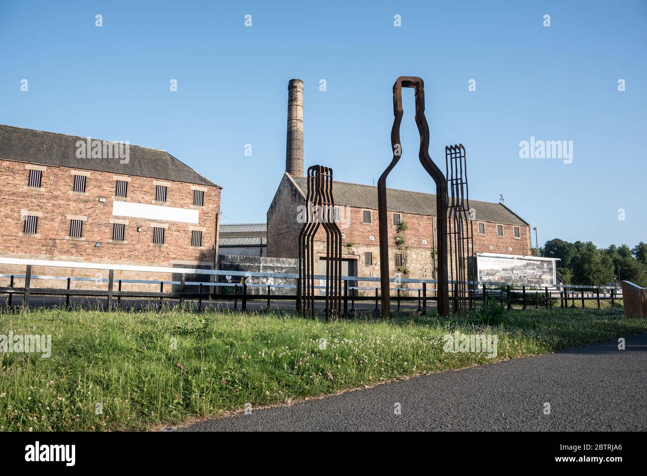Whisky Bottle sculptures opposite the derelict Roseband Distillery,  Lock 2 , Forth & Clyde Canal, Falkirk Stock Photo