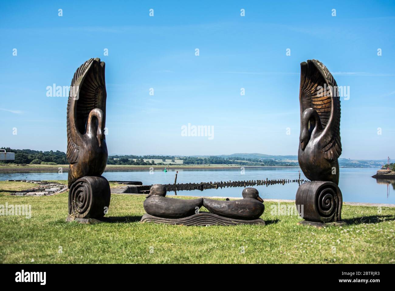 Carved bench featuring swans and ducks at Bowling Harbour Dumbarton Rd, Bowling Glasgow G60 5AF Stock Photo