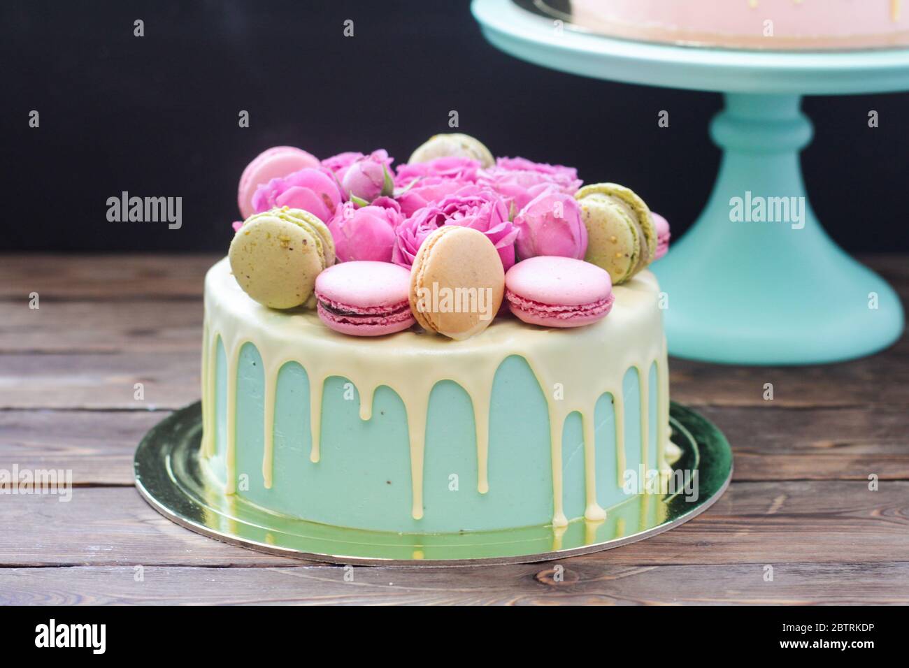 Turquoise Cake With White Melted Chocolate Fresh Roses And French Macaroons Decoration Rustic Wooden Background Stock Photo Alamy