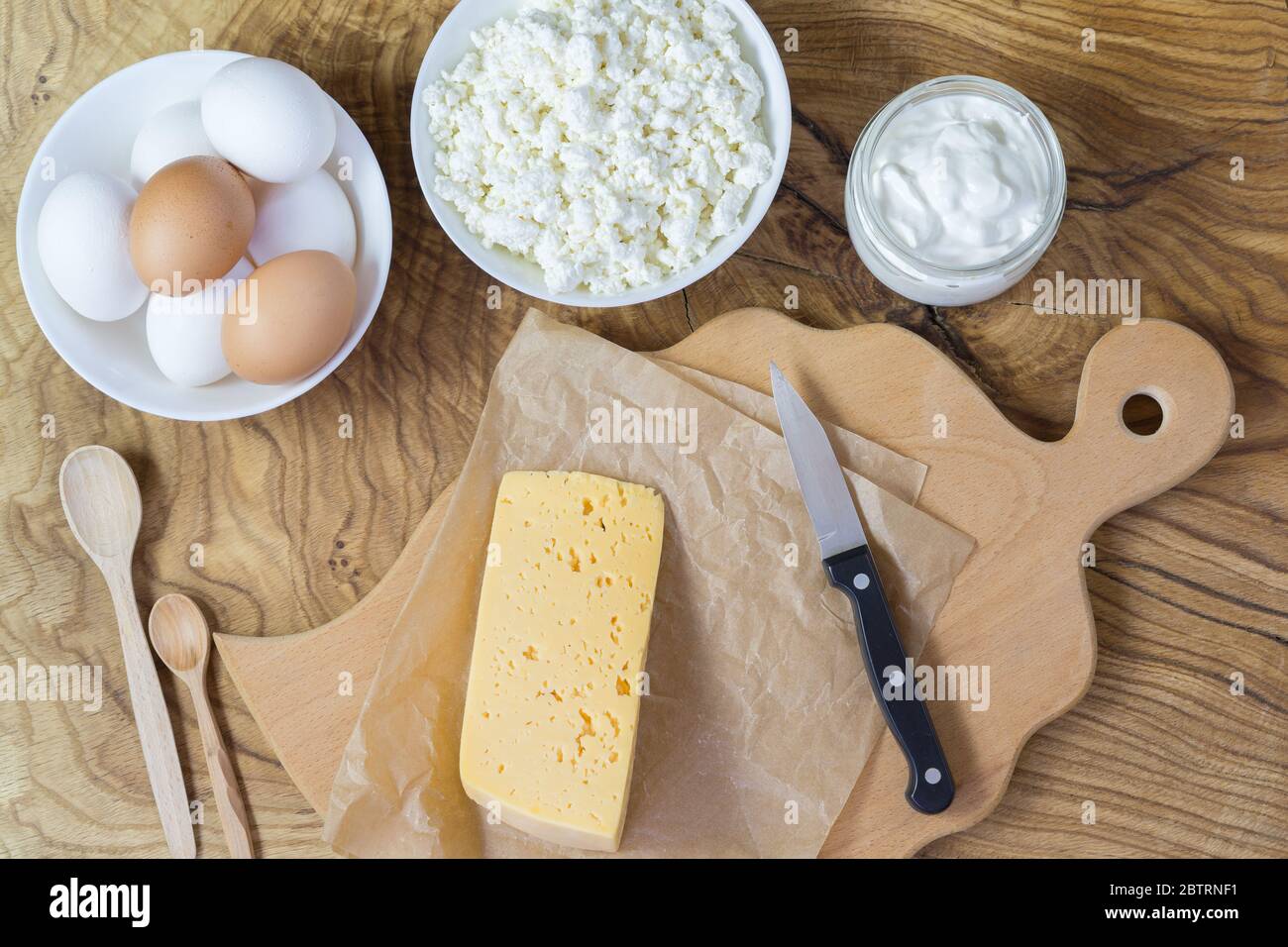 Fresh calciumrich dairy products and eggs are placed on the texture