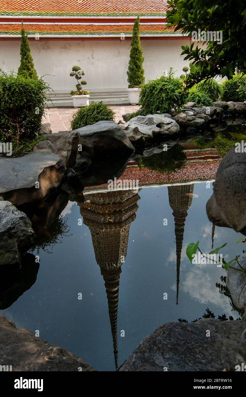 Garden pond at Wat Pho with reflection of domes in the water. Stock Photo