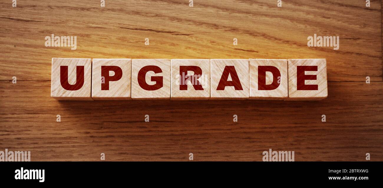 upgrade text on wooden cubes. technological concept Stock Photo
