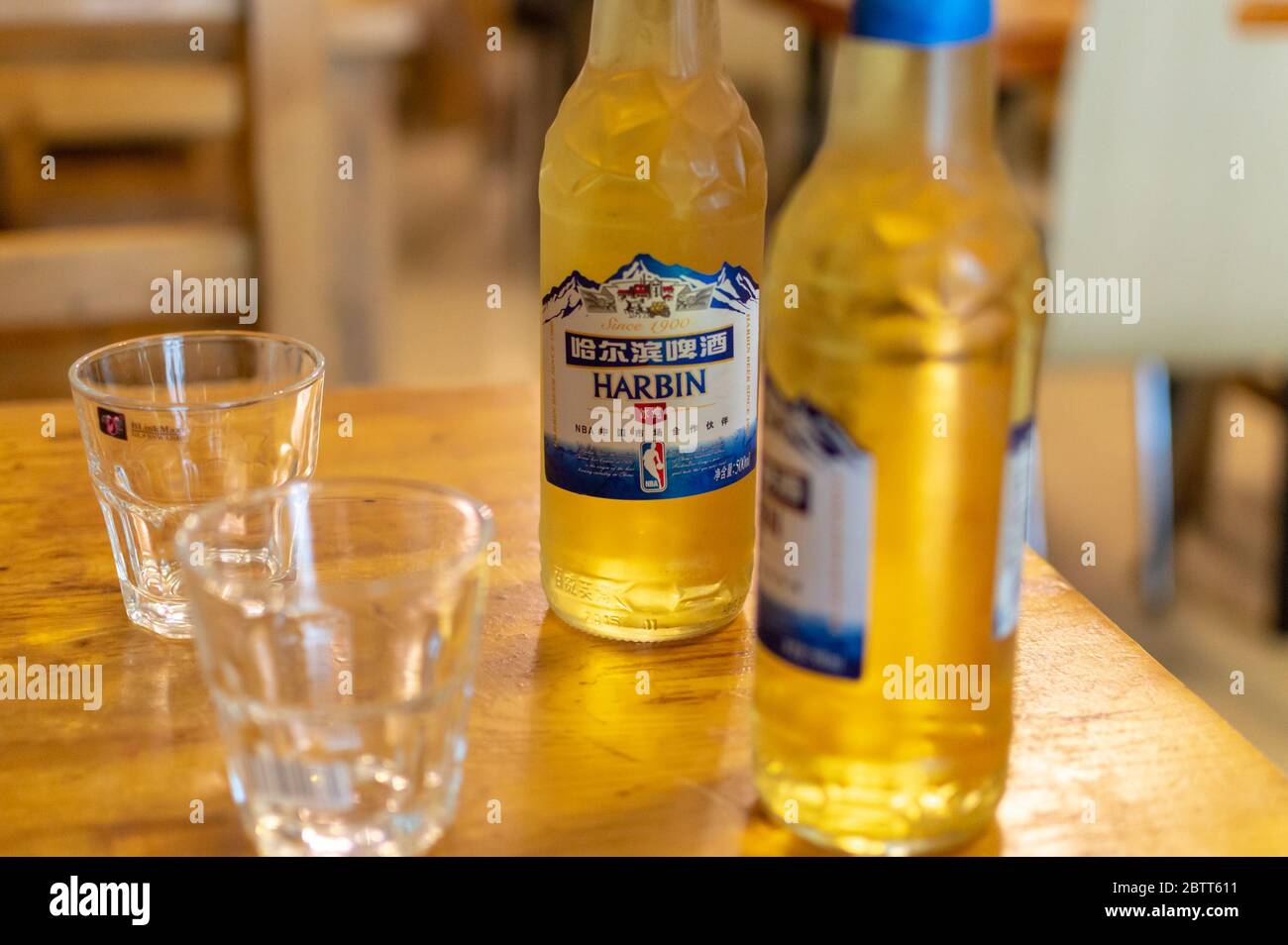 Beijing / China - July 17, 2017: Cold bottles of Harbin Beer served in the restaurant Stock Photo