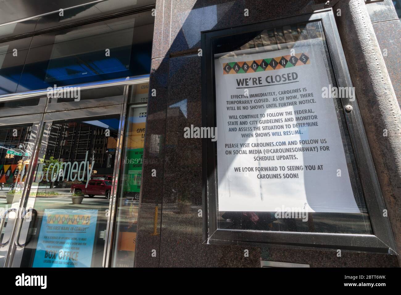 sign stating we're closed at Carolines on Broadway comedy club in Times Square due to the coronavirus or covid-19 pandemic Stock Photo
