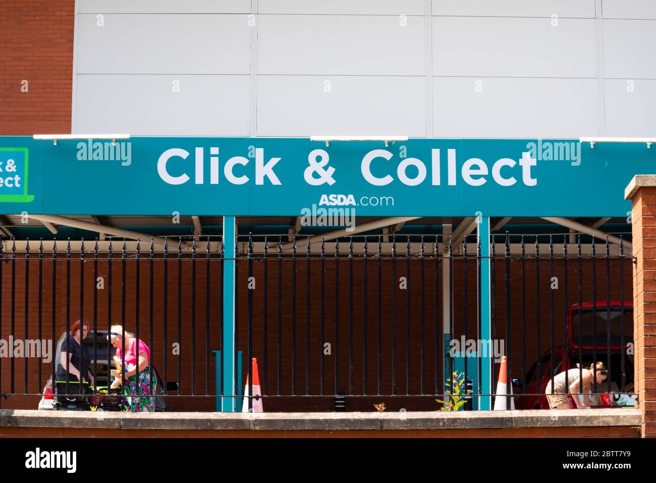 ASDA supermarket “click & collect” bays with customers loading cars. Grantham, Lincolnshire, England. May 2020 Stock Photo