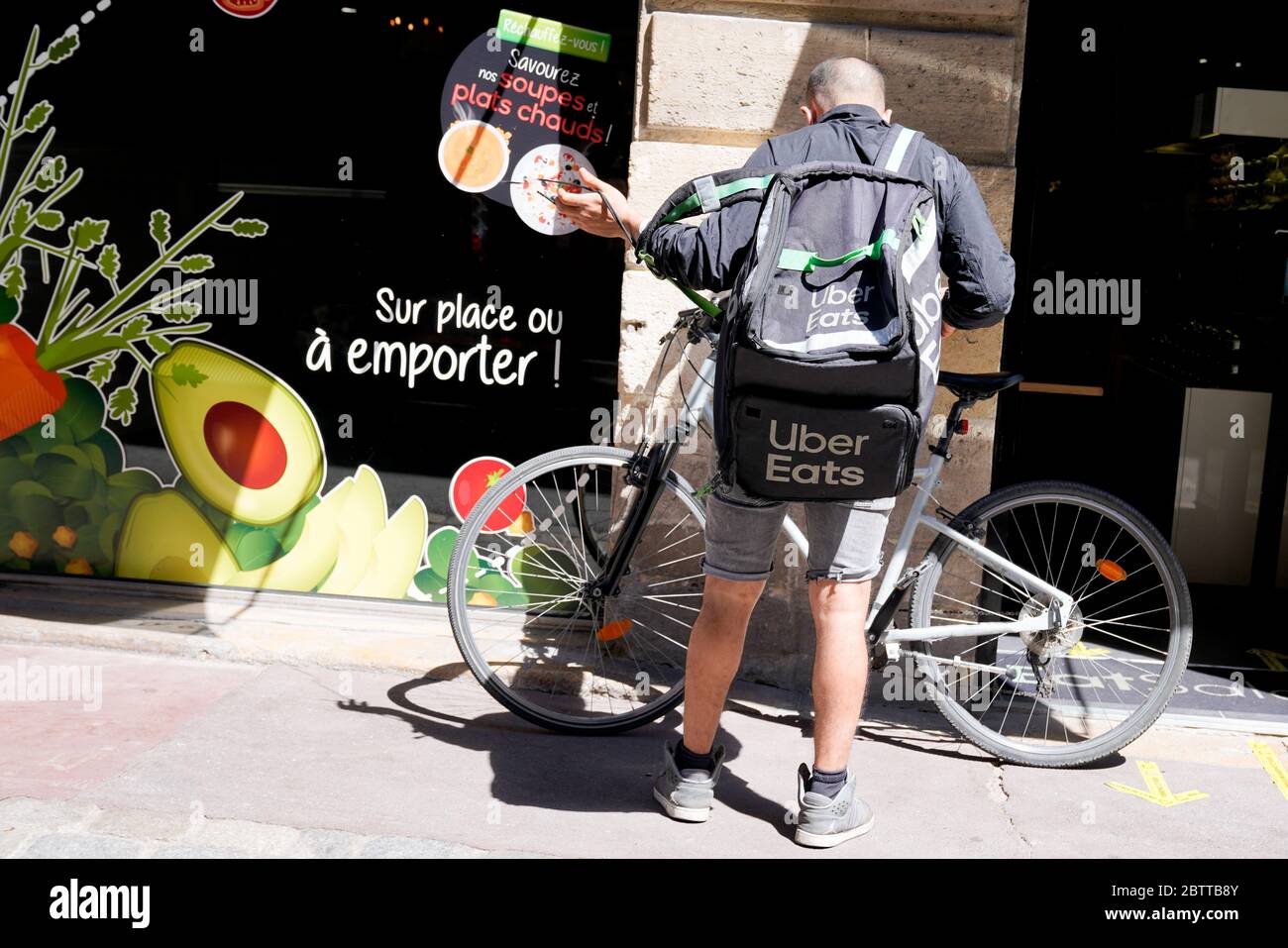 Bordeaux , Aquitaine / France - 05 05 2020 : Uber eats bike delivery man with backpack cycle Stock Photo
